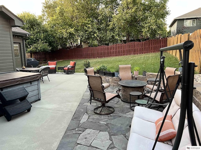 view of patio with a fire pit