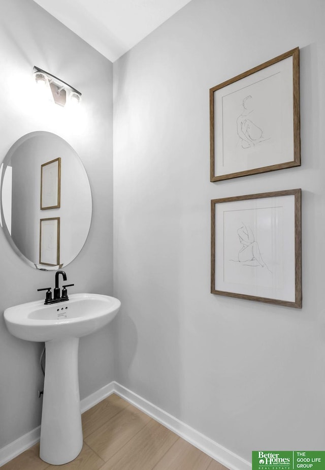 bathroom with hardwood / wood-style floors