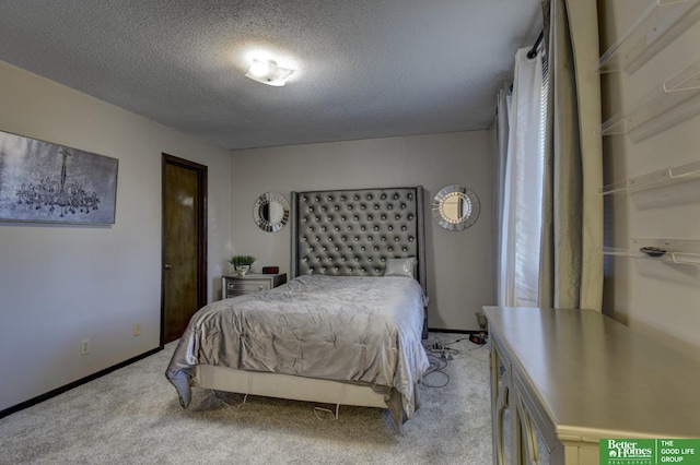 carpeted bedroom with a textured ceiling