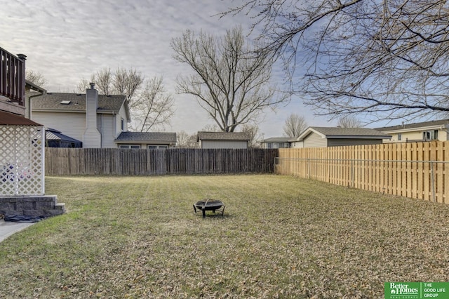 view of yard featuring an outdoor fire pit