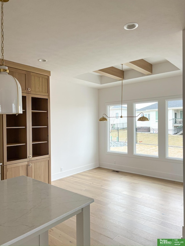 unfurnished dining area with light hardwood / wood-style flooring