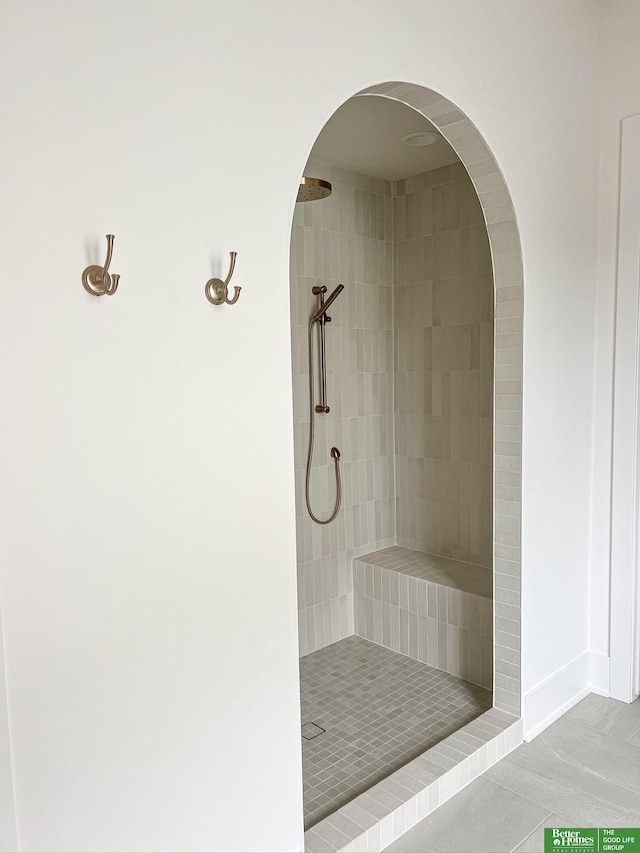 bathroom with tile patterned floors and walk in shower