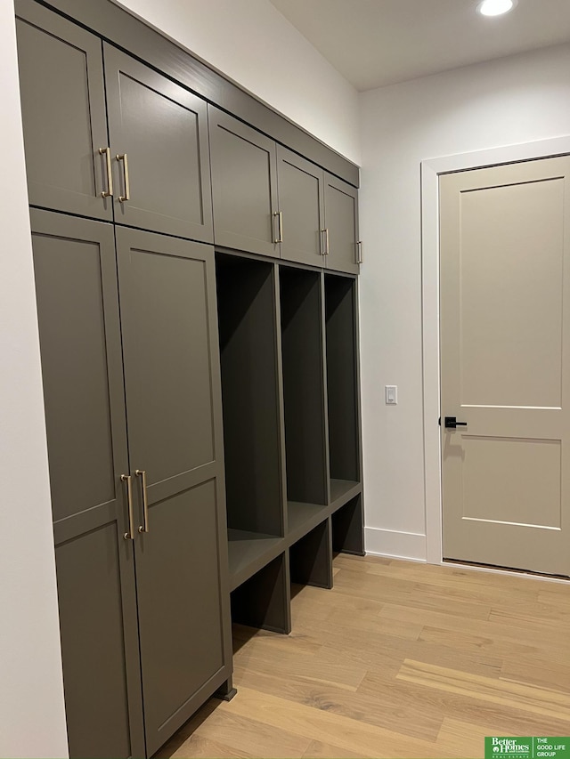 mudroom with light hardwood / wood-style floors