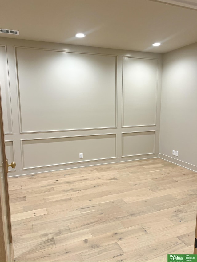 spare room featuring light hardwood / wood-style floors