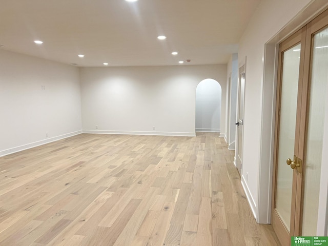 empty room with light hardwood / wood-style floors