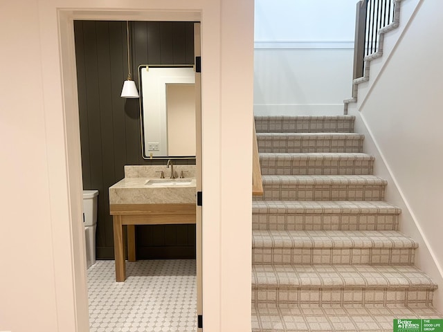 stairs featuring sink