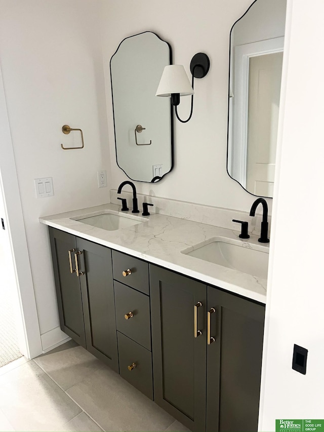 bathroom with tile patterned flooring and vanity