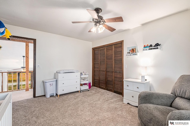 sitting room with light carpet and ceiling fan