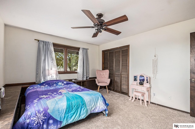 bedroom featuring ceiling fan, a closet, and carpet