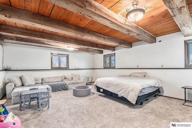 bedroom featuring beam ceiling, light colored carpet, and wooden ceiling