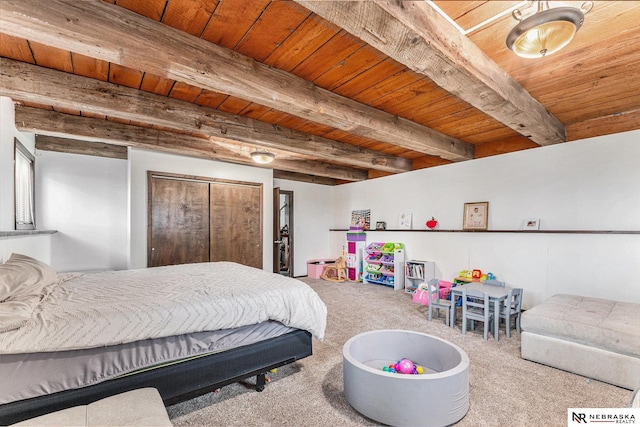 carpeted bedroom with beam ceiling and wood ceiling