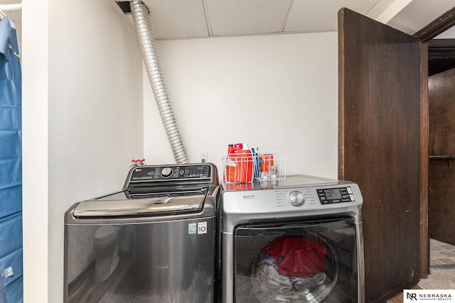 clothes washing area with washing machine and clothes dryer