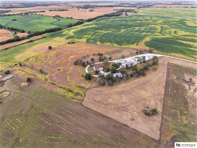 birds eye view of property with a rural view