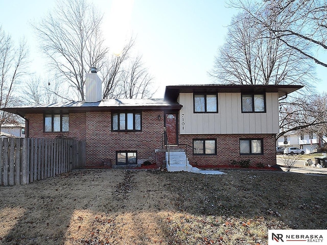 back of property featuring a lawn