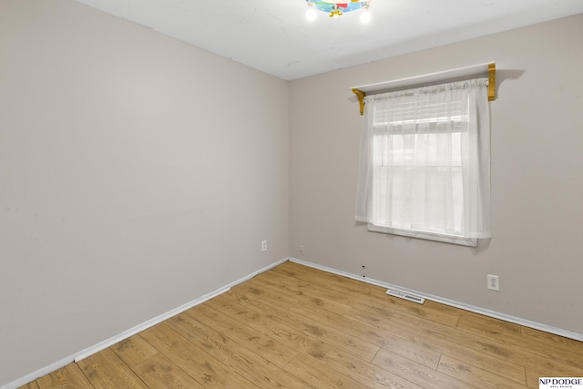 unfurnished room featuring light hardwood / wood-style flooring