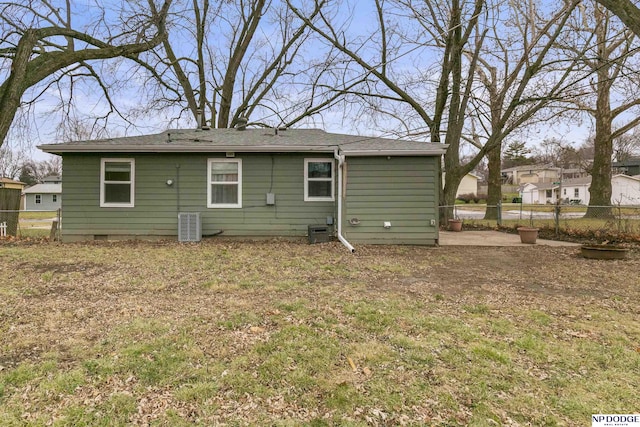 back of house with central AC