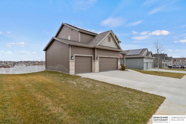 view of side of home featuring a garage and a lawn