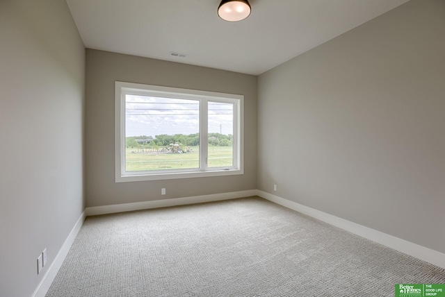 unfurnished room with light carpet