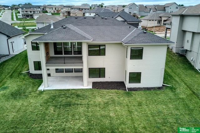 back of property featuring a patio area, a yard, and cooling unit