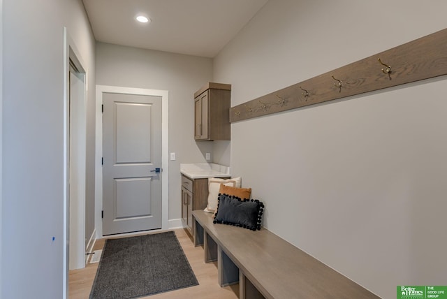 mudroom with light hardwood / wood-style flooring