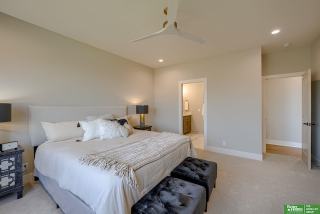 carpeted bedroom with connected bathroom and ceiling fan