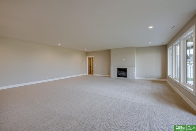 unfurnished living room with light carpet