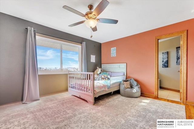 carpeted bedroom with ceiling fan