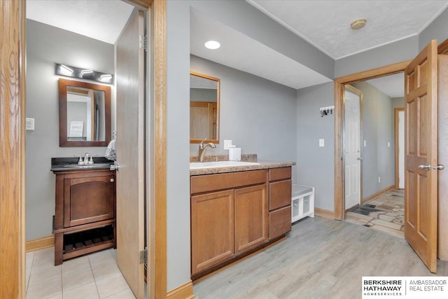 bathroom featuring vanity and wood-type flooring