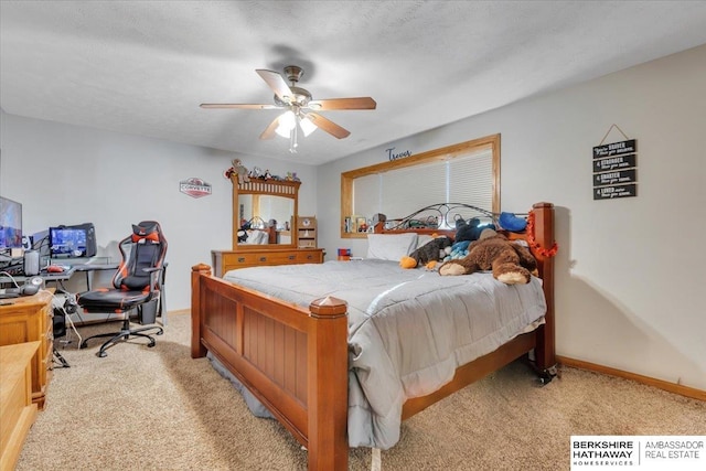 bedroom with ceiling fan, light colored carpet, and a textured ceiling