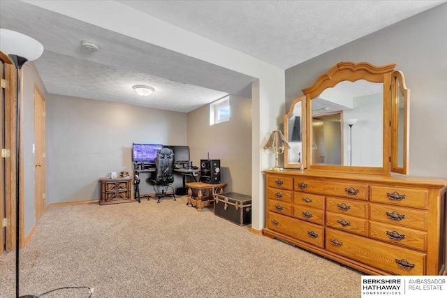 office space with carpet and a textured ceiling