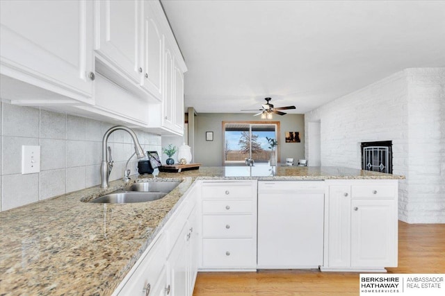 kitchen with white cabinetry, sink, ceiling fan, tasteful backsplash, and white dishwasher