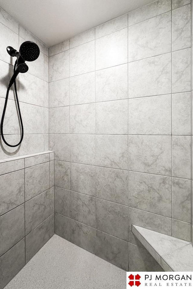 bathroom with tiled shower