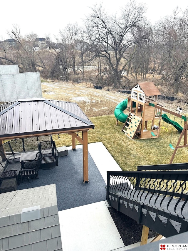 view of patio / terrace featuring a playground and a gazebo