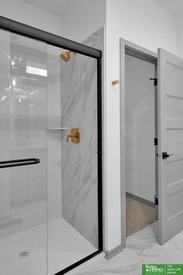 bathroom featuring an enclosed shower