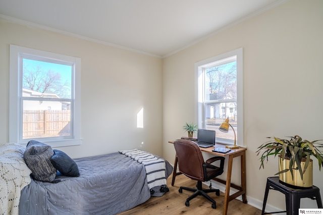 bedroom featuring wood-type flooring and crown molding