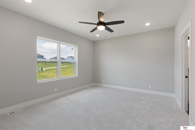 empty room with carpet and ceiling fan