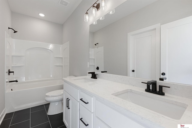 full bathroom with tile patterned floors, vanity, toilet, and shower / tub combination