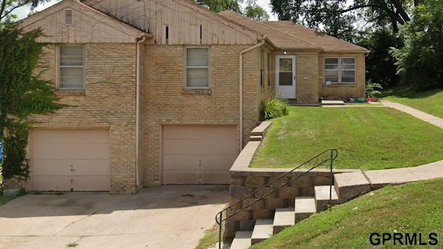 view of front of home with a garage and a front yard