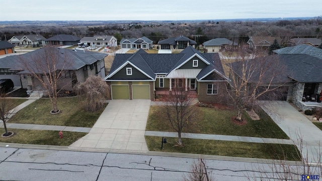 view of front of property featuring a garage and a front lawn