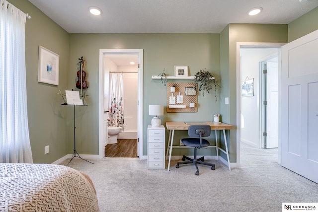 carpeted bedroom with ensuite bath