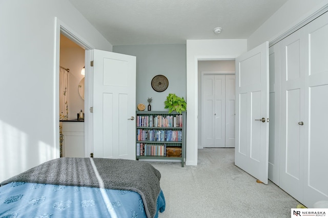 carpeted bedroom with a closet