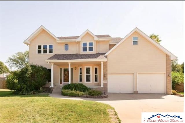 view of front facade featuring a garage and a front yard