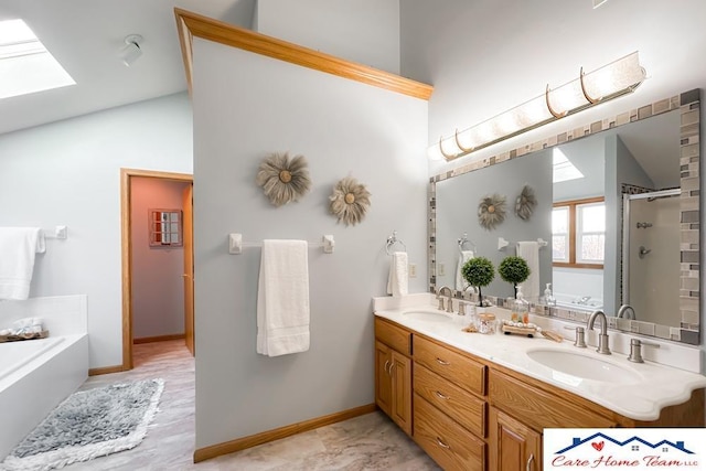 bathroom featuring vaulted ceiling with skylight, vanity, and separate shower and tub