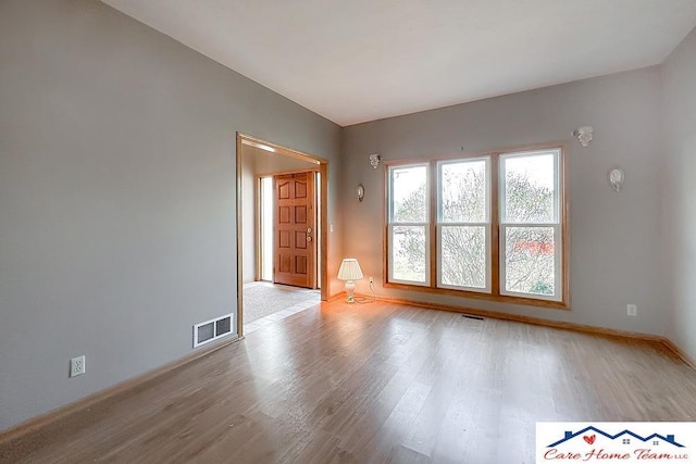 unfurnished living room featuring light hardwood / wood-style flooring