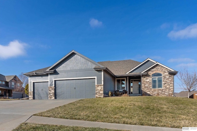 craftsman-style home with a garage and a front lawn