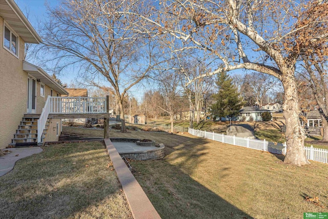 view of yard featuring a wooden deck