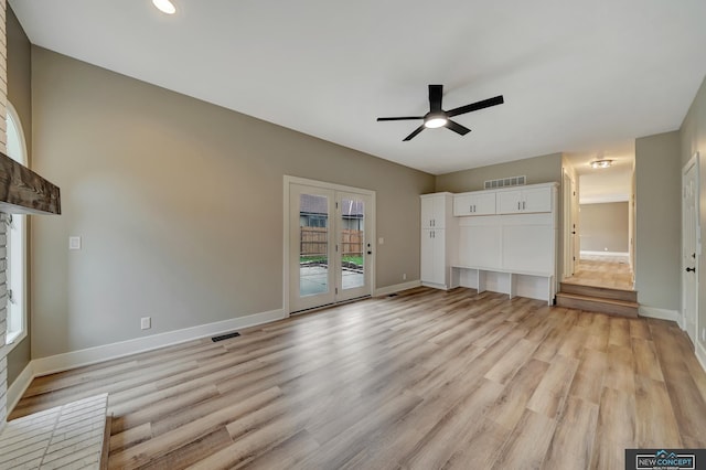 unfurnished living room with french doors, light hardwood / wood-style floors, and ceiling fan