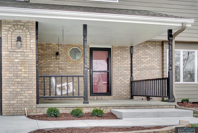 entrance to property featuring a porch