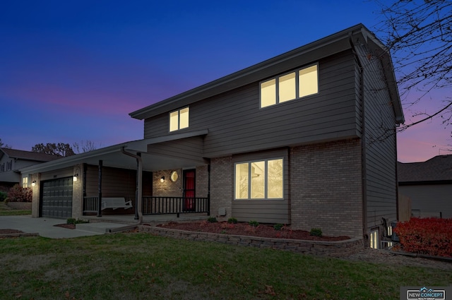 exterior space with a lawn, a porch, and a garage