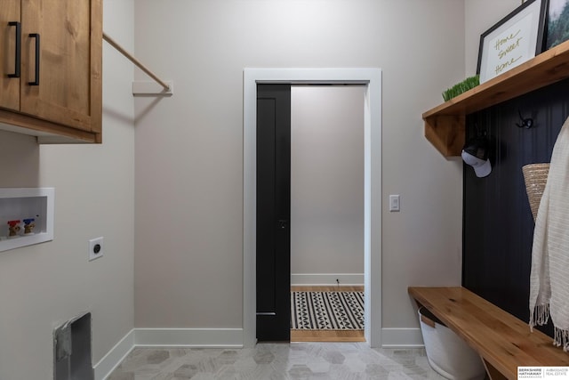 washroom featuring hookup for an electric dryer, cabinets, and washer hookup